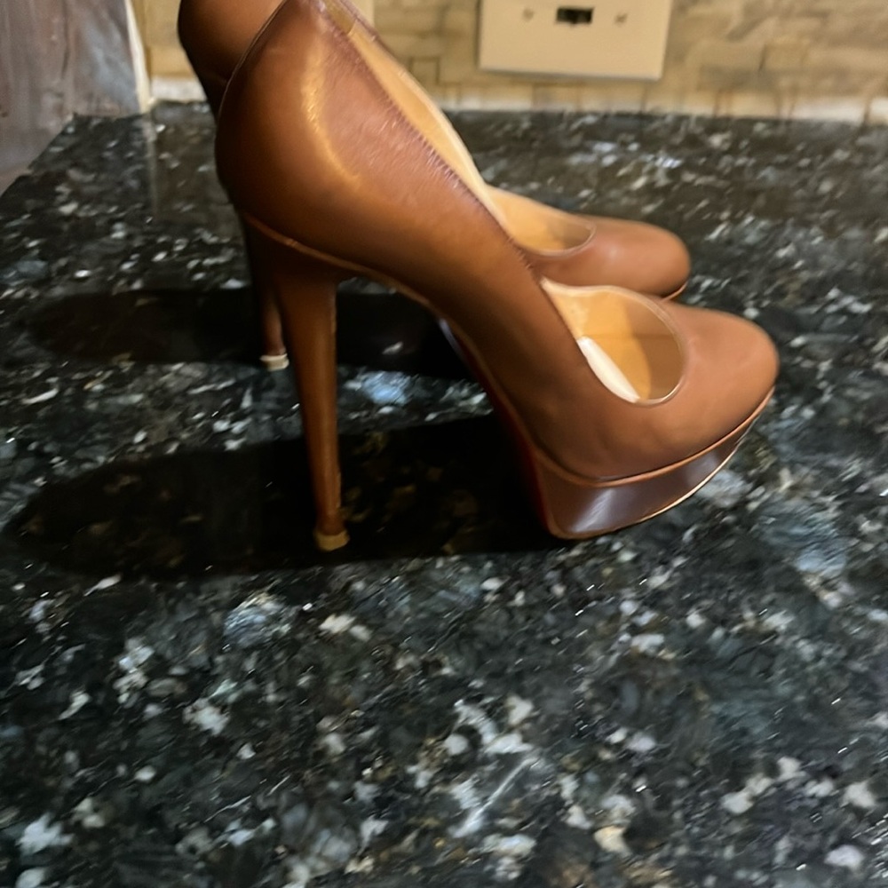 Louboutin sable (brown) pumps.  Absolutely gorgeous with box and dust bag